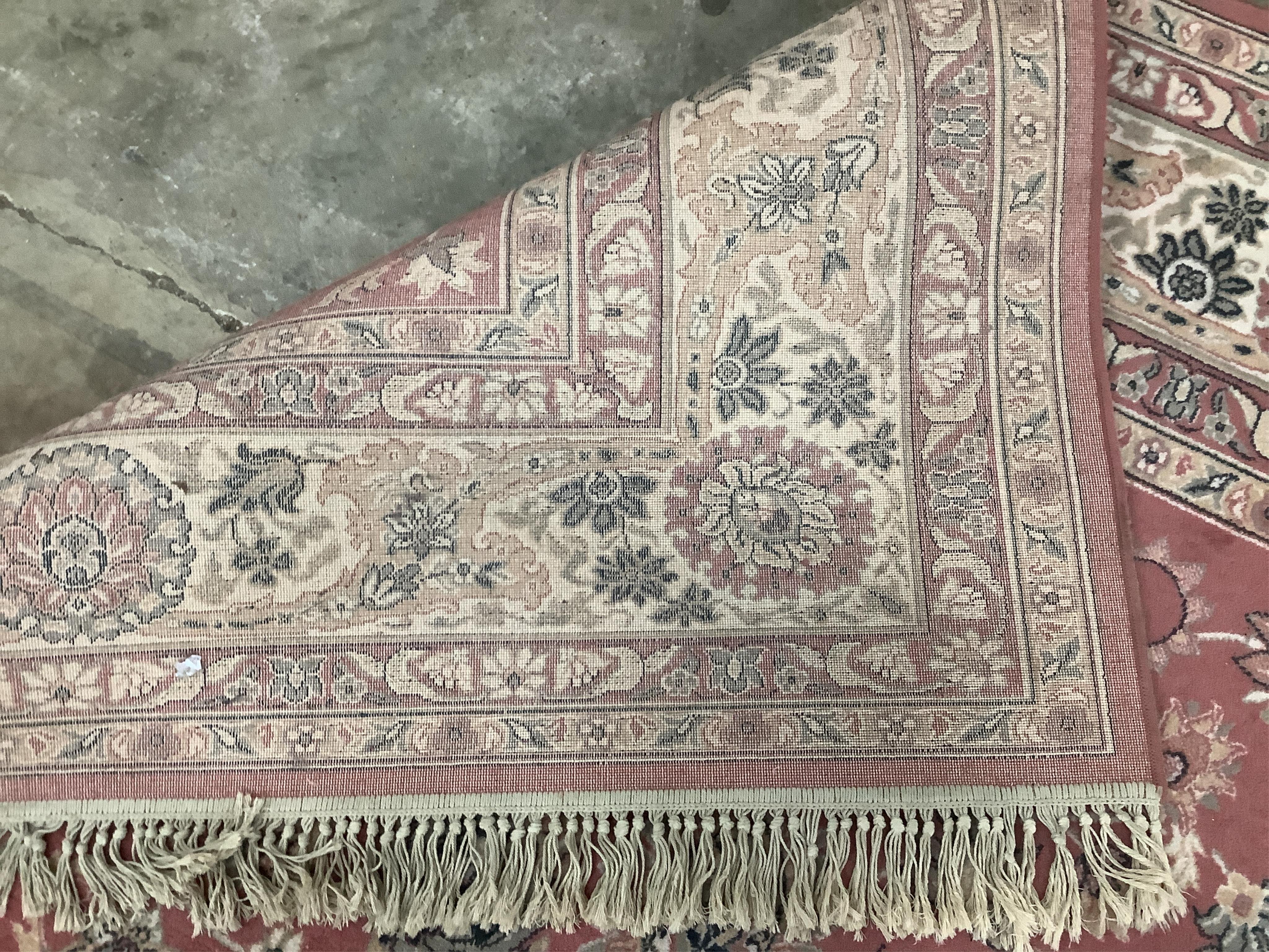 A Kashan style peach ground machined carpet, 360 x 274cm. Condition - fair to good, will require cleaning